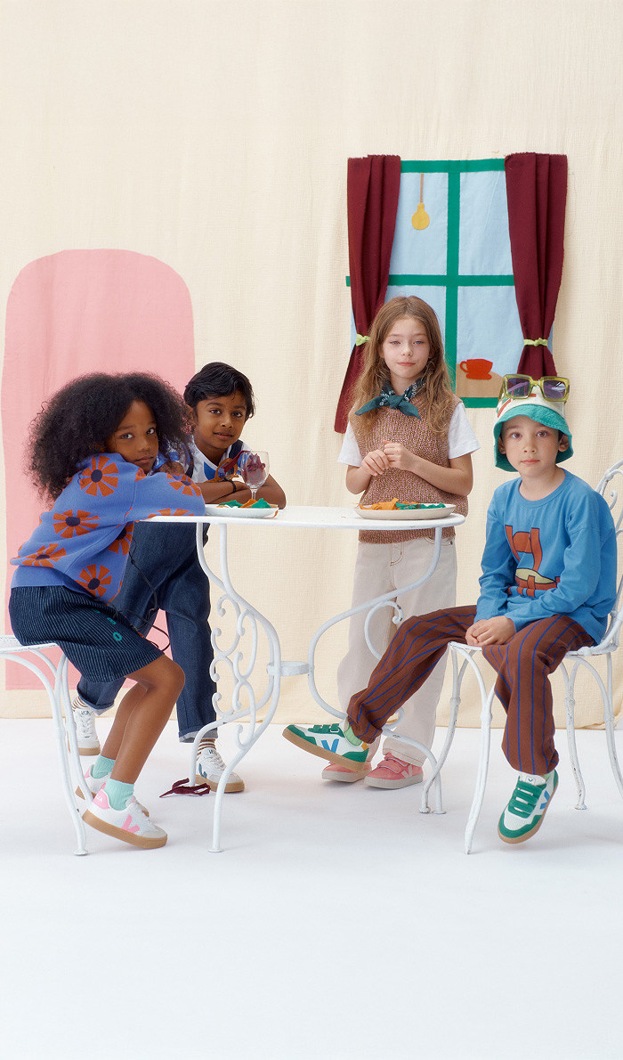 Four kids wearing Veja sneakers